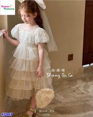 Đầm tiệc kem tầng đính nơ