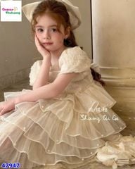 Đầm tiệc kem tầng đính nơ