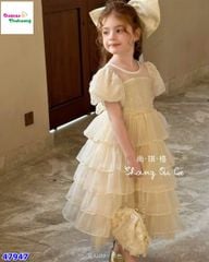 Đầm tiệc kem tầng đính nơ