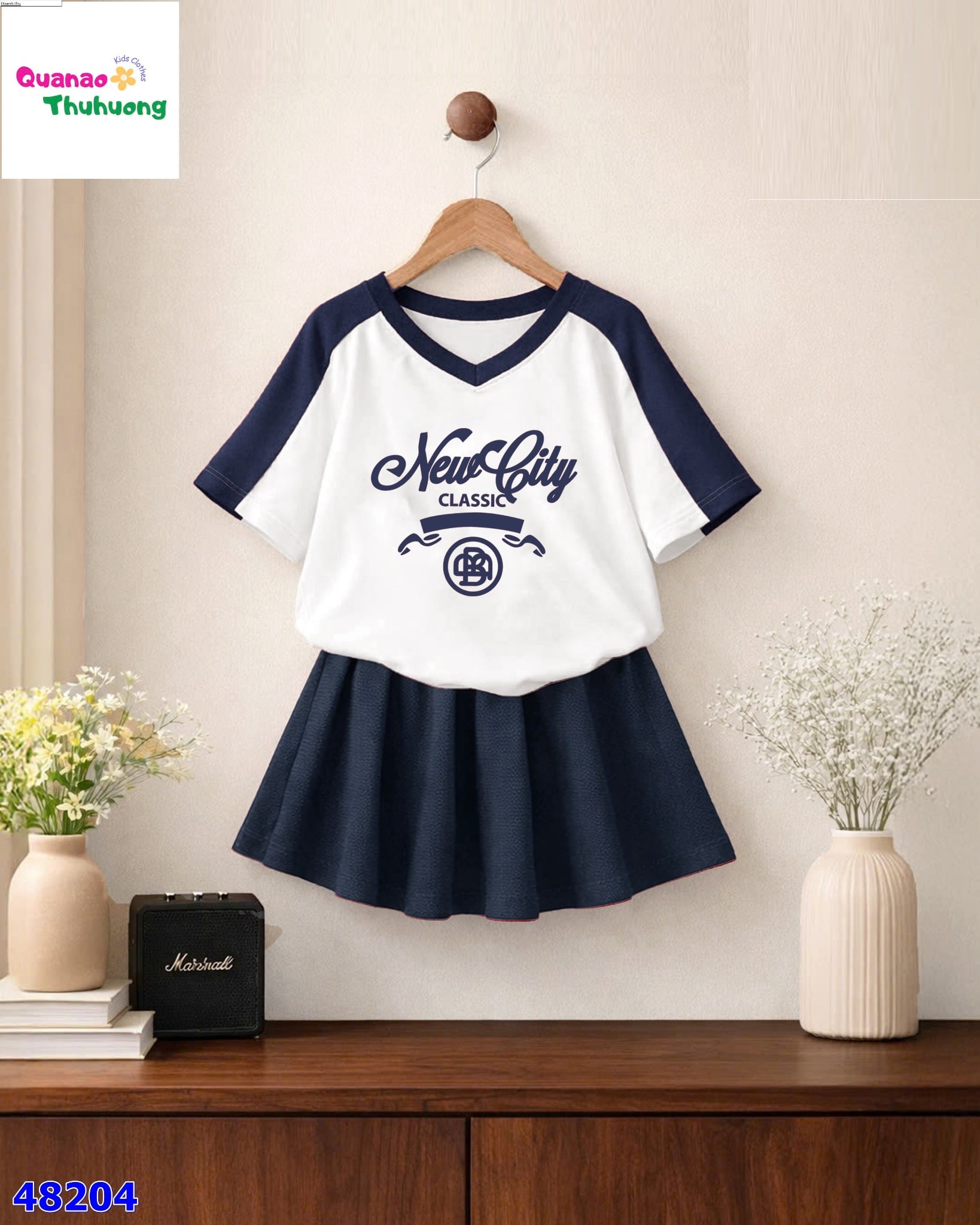 Set Nexxi áo Newcity, váy xếp ly xanh đen