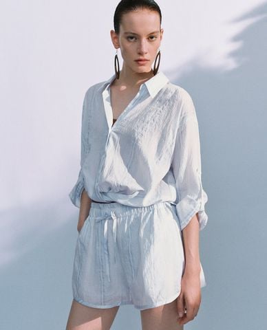  URBAN REVIVO - Áo sơ mi nữ cổ bẻ tay dài xoắn eo 