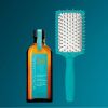 Giftset Moroccanoil Lunar New Year Set (1 Tinh Dầu Dưỡng Tóc 100ml + 1 Lược Gỡ Rối Mini)