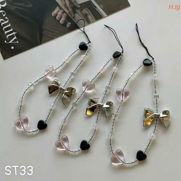 Dây đeo điện thoại tim nơ bạc ST33