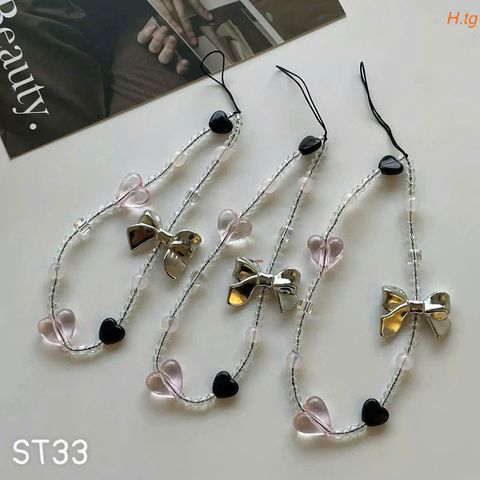 Dây đeo điện thoại tim nơ bạc ST33