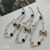 Dây đeo điện thoại tim nơ bạc ST33