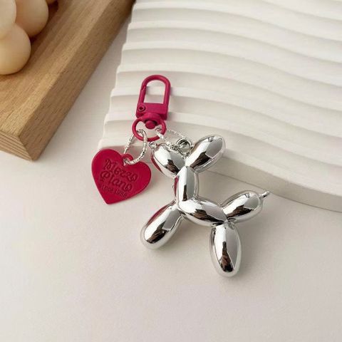 Móc khóa cún bạc tim