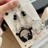 Móc khóa tai nghe trắng đen