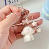 Móc khóa cún trắng nơ phủ lông