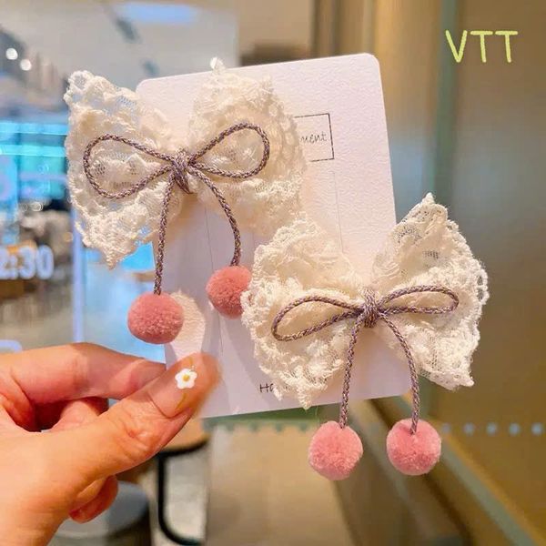 Vỉ 2 kẹp nơ trắng cục bông