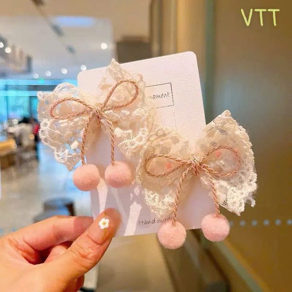 Vỉ 2 kẹp nơ trắng cục bông