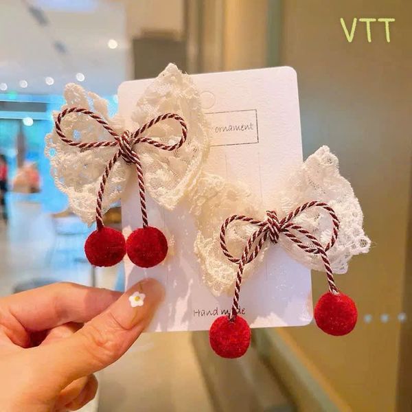 Vỉ 2 kẹp nơ trắng cục bông