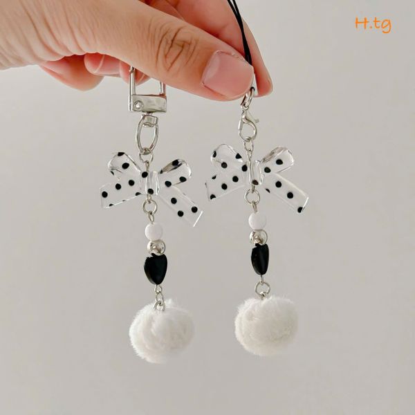 Móc treo nơ chấm bi cục bông đen trắng