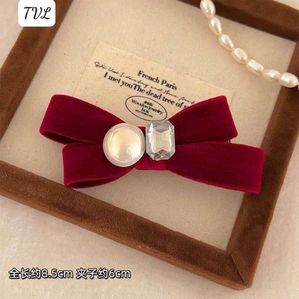 1 Kẹp nơ nhung trai đá đỏ đen