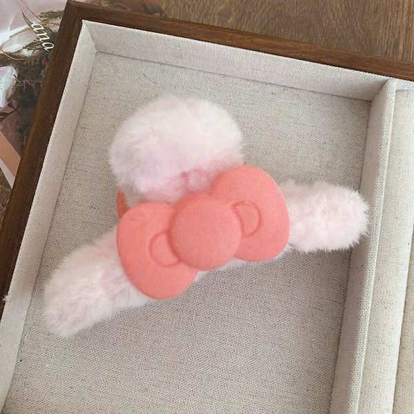 Cào lông nơ hồng