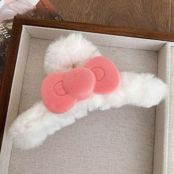 Cào lông nơ hồng