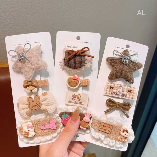 Vỉ 4 kẹp len tông nâu ts B34