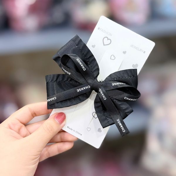 Kẹp nơ CHANGE trắng đen