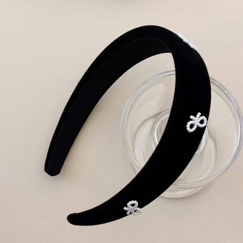 Cài xốp đỏ - đen bản lớn họa tiết nơ