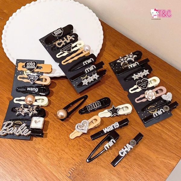 Vỉ 6-7 kẹp charm hiệu ( vỉ đen )