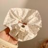 Scrunchies vải chấm bi trắng đính Cúc