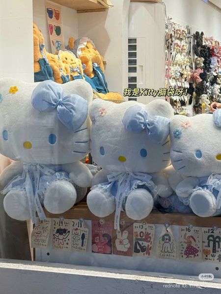 Hello kitty váy xanh đeo nơ xanh 45cm