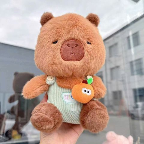 Cappy Nâu mặc yếm xanh lá ôm cam 25cm m28