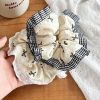 Scrunchies caro nhiều nơ đen trắng