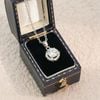 Dây chuyền bạc Việt Nam xi vàng trắng tròn xoáy ổ đá giữa Kim Cương Moissanite | Cáo Bạc