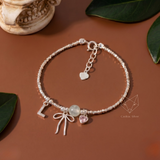  Lắc tay bạc Việt Nam Personal Bloom charm nơ chữ tim đính đá | Cáo Bạc 