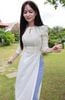 Áo dài gấm trắng 2 nơ xinh xắn
