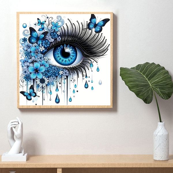 Tranh đính đá nghệ thuật hình đôi mắt xanh – Thiết kế 3D sống động, kèm bướm và hoa xanh, kích thước 30x30cm