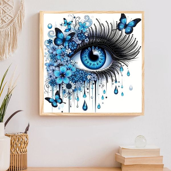 Tranh đính đá nghệ thuật hình đôi mắt xanh – Thiết kế 3D sống động, kèm bướm và hoa xanh, kích thước 30x30cm