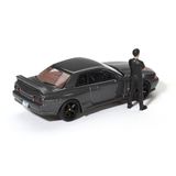  MINI GT - [KÈM FIGURE] 1/64 NISSAN SKYLINE GT-R R32 NISMO GUNMETAL WITH MATSUDA FIGURE TSUGIO MATSUDA COLLECTION - 869 