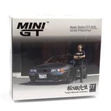  MINI GT - [KÈM FIGURE] 1/64 NISSAN SKYLINE GT-R R32 NISMO GUNMETAL WITH MATSUDA FIGURE TSUGIO MATSUDA COLLECTION - 869 