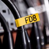  Brother TZe-FX651, khổ 24mm, dài 8m, Black on Yellow, siêu dẻo, chống thấm nước 