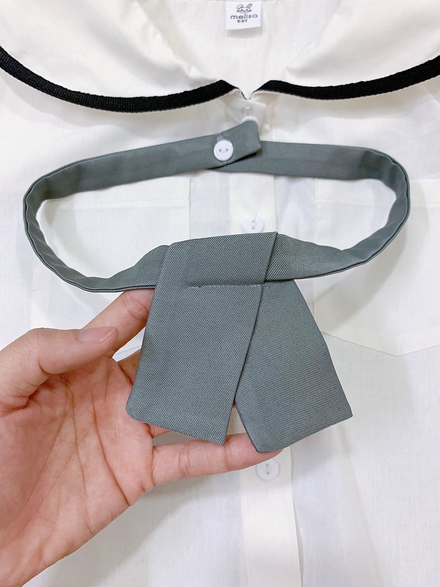 Set thô Melisa áo trắng kèm cavat - chân váy liền quần màu navy size 2 - 11y