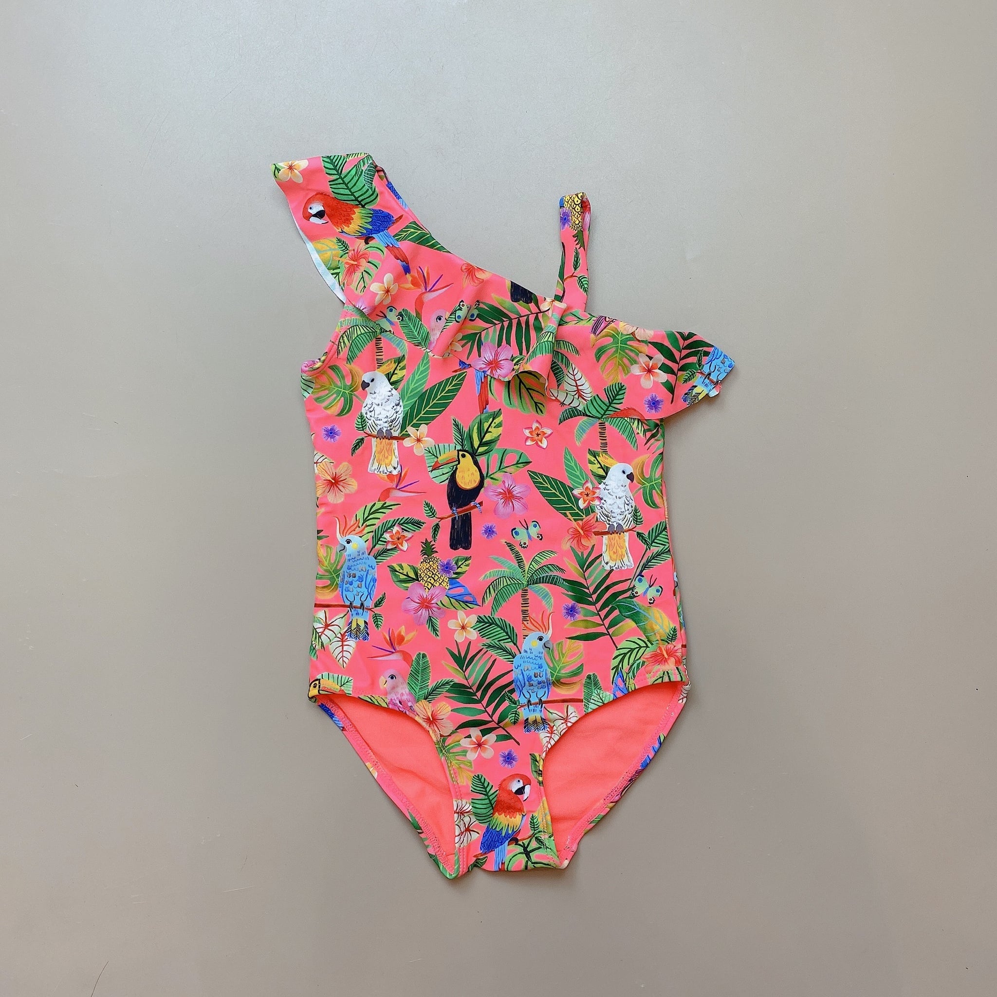 Bộ bơi liền HM màu cam neon hình vẹt vạt bèo lệch size 2 - 10y