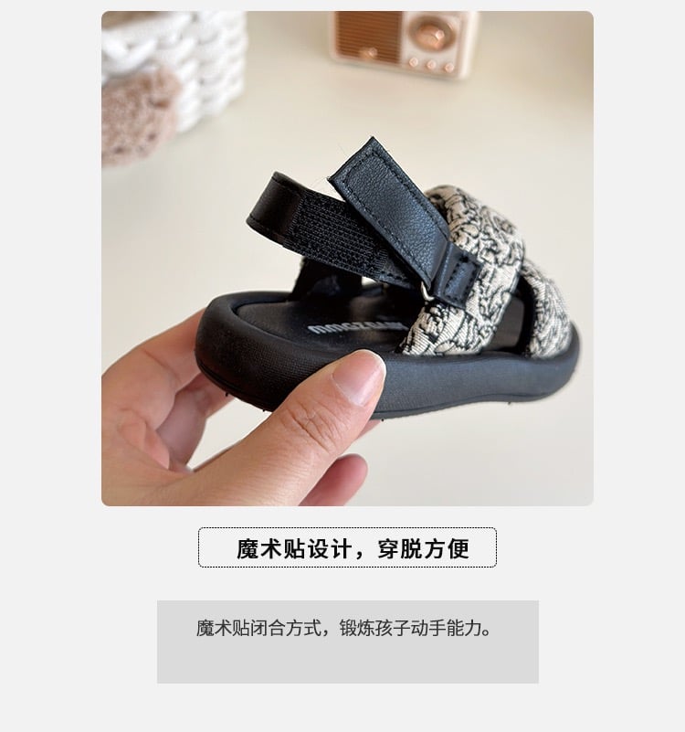 V1026 - Sandal MGbaby quai chéo 2 màu đen, trắng hoa bé gái size 21-30