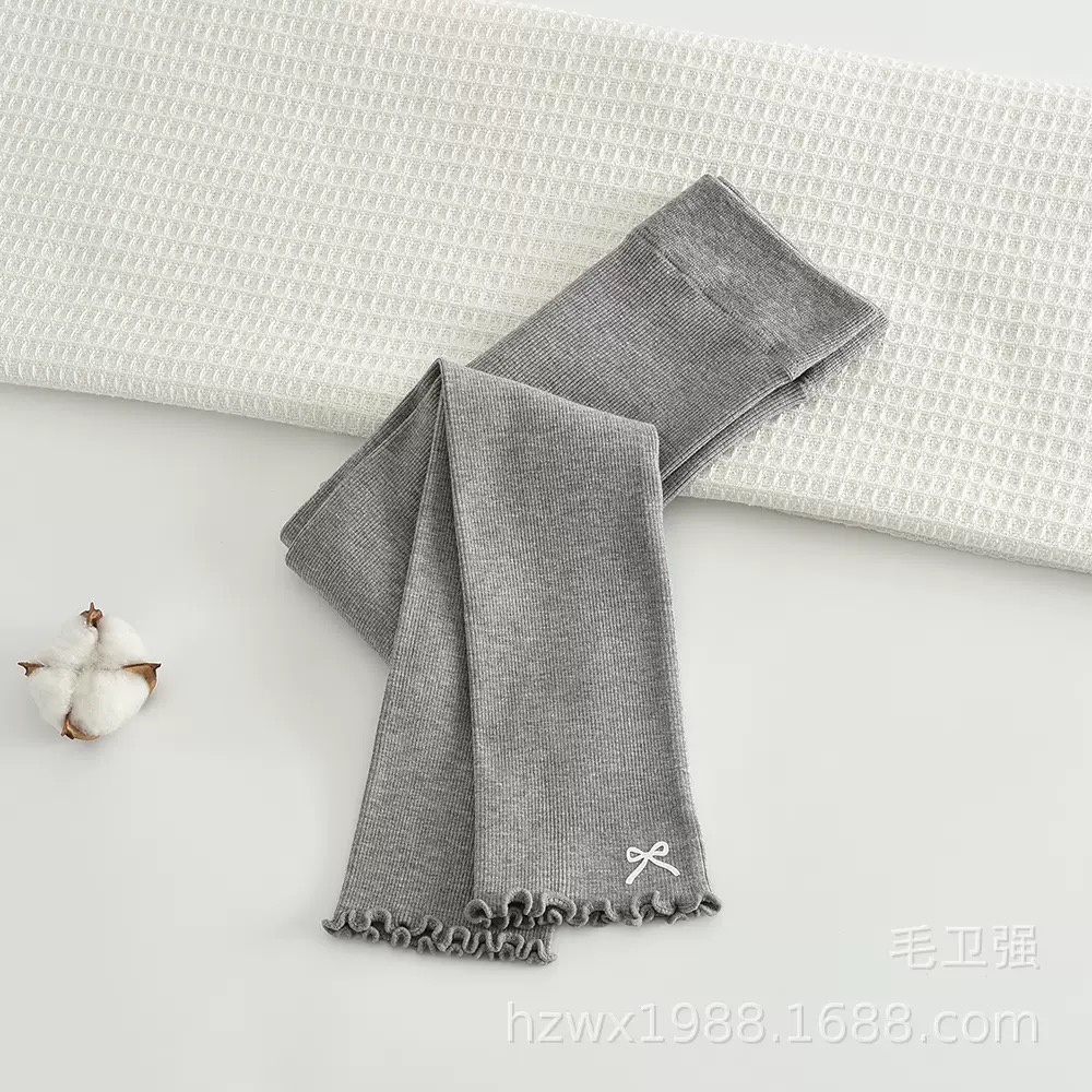 Quần len không bàn đính nơ gấu cho bé gái size 90-135cm