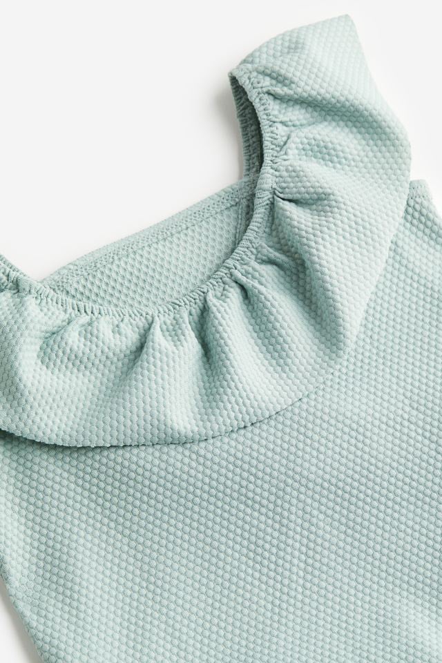 Bộ bơi liền HM tổ ong bèo vạt 3 màu hồng nhạt / mint / hồng đất size 6m - 4y