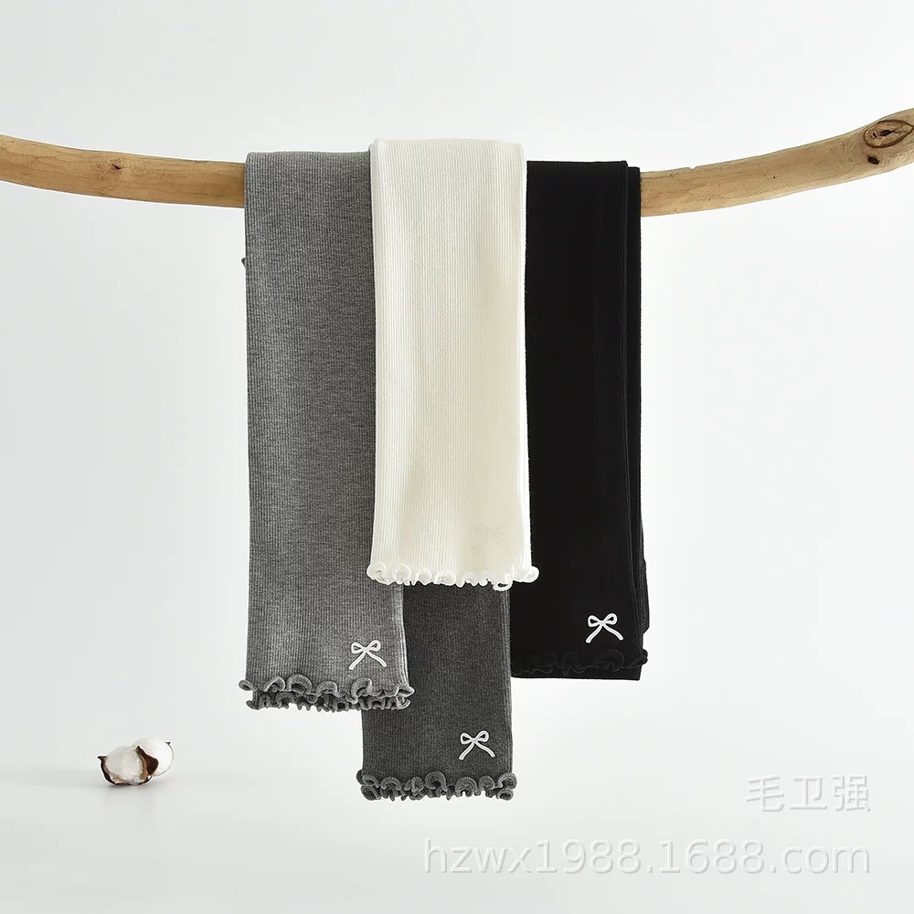 Quần len không bàn đính nơ gấu cho bé gái size 90-135cm