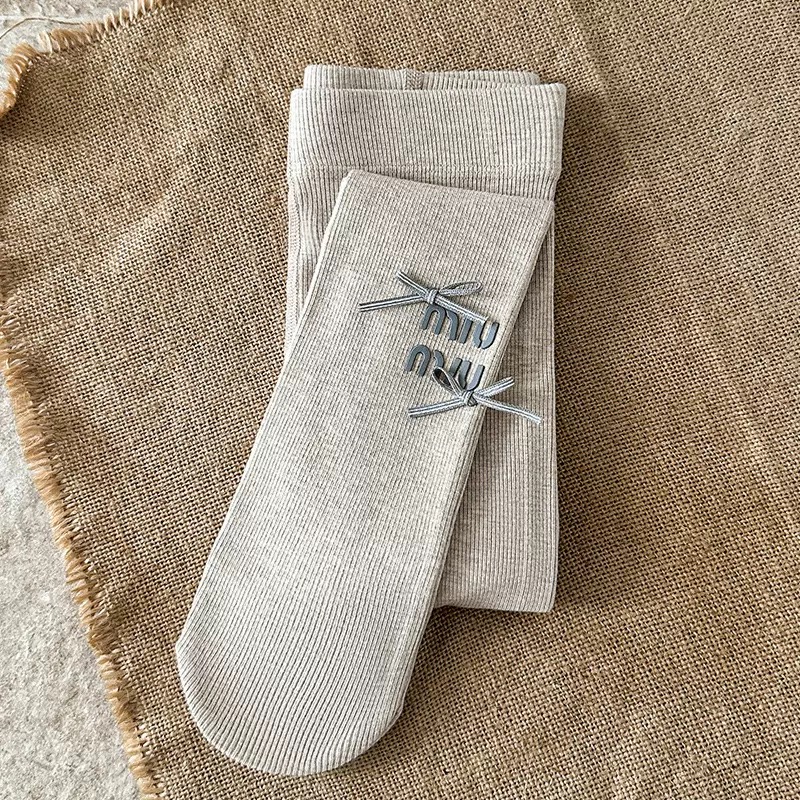 Quần tất thun tăm mùa xuân Miumiu đính nơ trơn nhiều màu cho bé size 4-12y