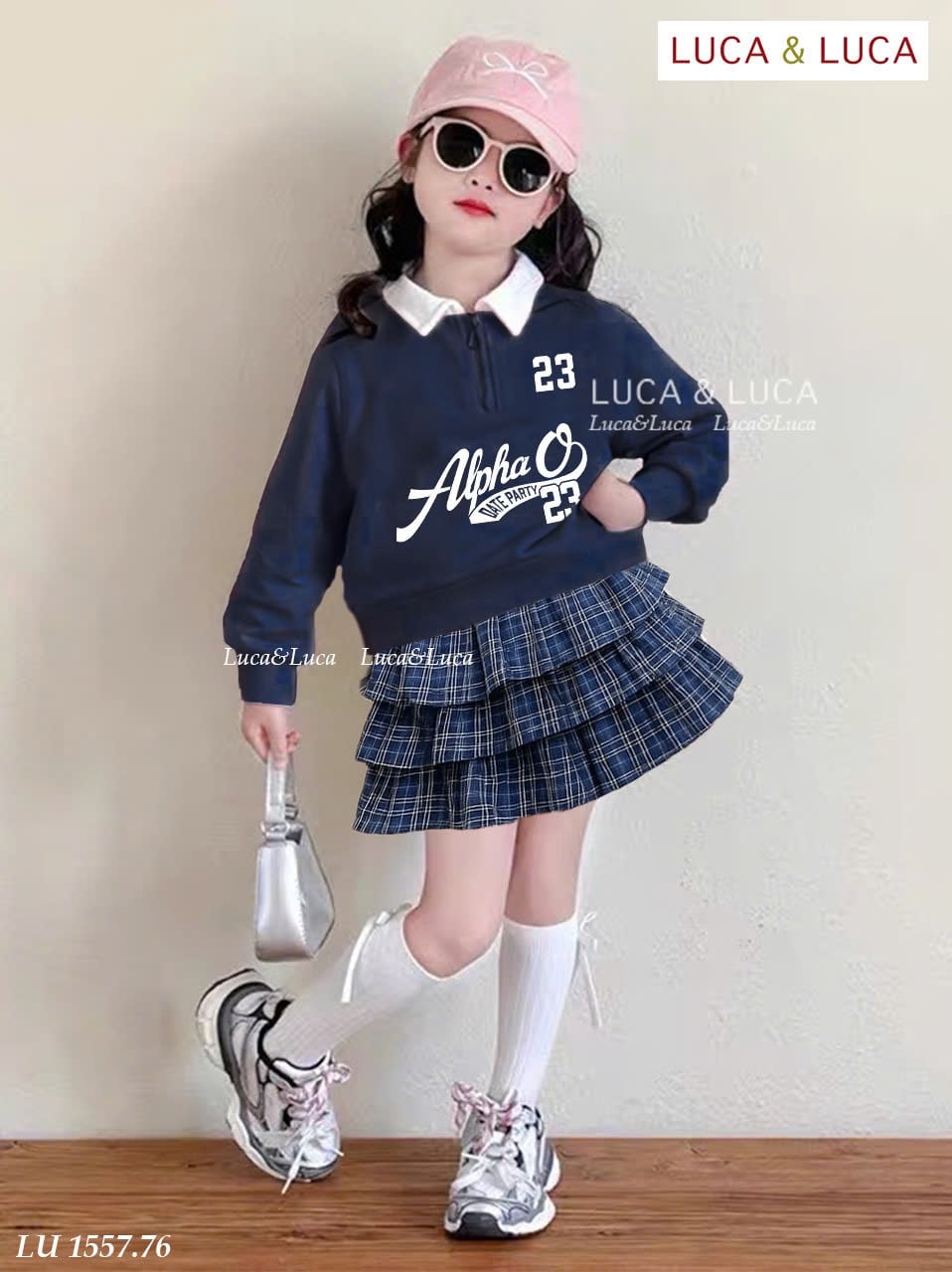 LU 1557 - Bộ bé gái Luca áo nỉ xanh Alpha 23 + chân váy kẻ 3 tầng size 2-12y