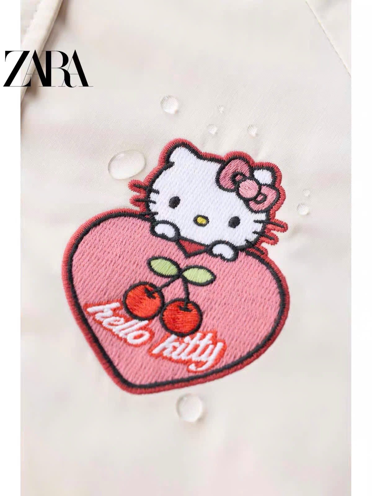 AK63 - Áo khoác bomber Hello Kitty màu be vải chống thấm size 2-6y