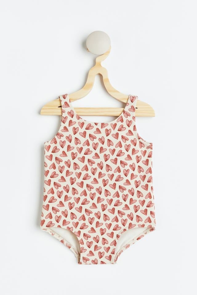 Bộ bơi liền HM màu kem hình tim nâu đỏ size 18m - 3y