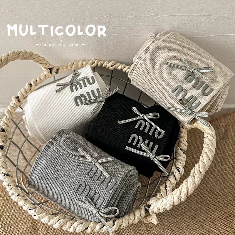 Quần tất thun tăm mùa xuân Miumiu đính nơ trơn nhiều màu cho bé size 4-12y