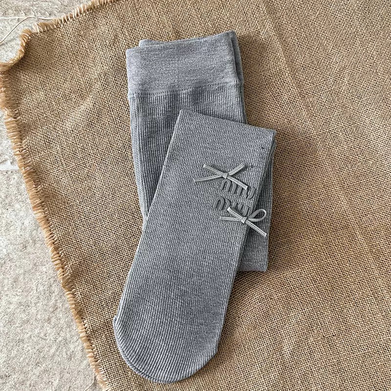 Quần tất thun tăm mùa xuân Miumiu đính nơ trơn nhiều màu cho bé size 4-12y