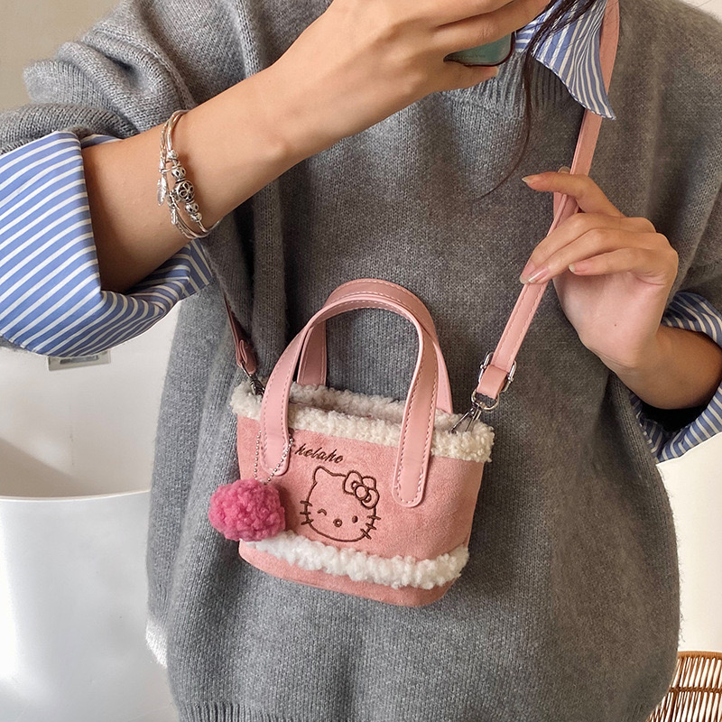 Túi xách đeo chéo da lộn Hello Kitty nhiều màu cho bé