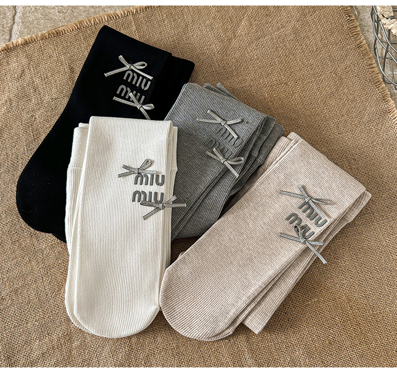 Quần tất thun tăm mùa xuân Miumiu đính nơ trơn nhiều màu cho bé size 4-12y