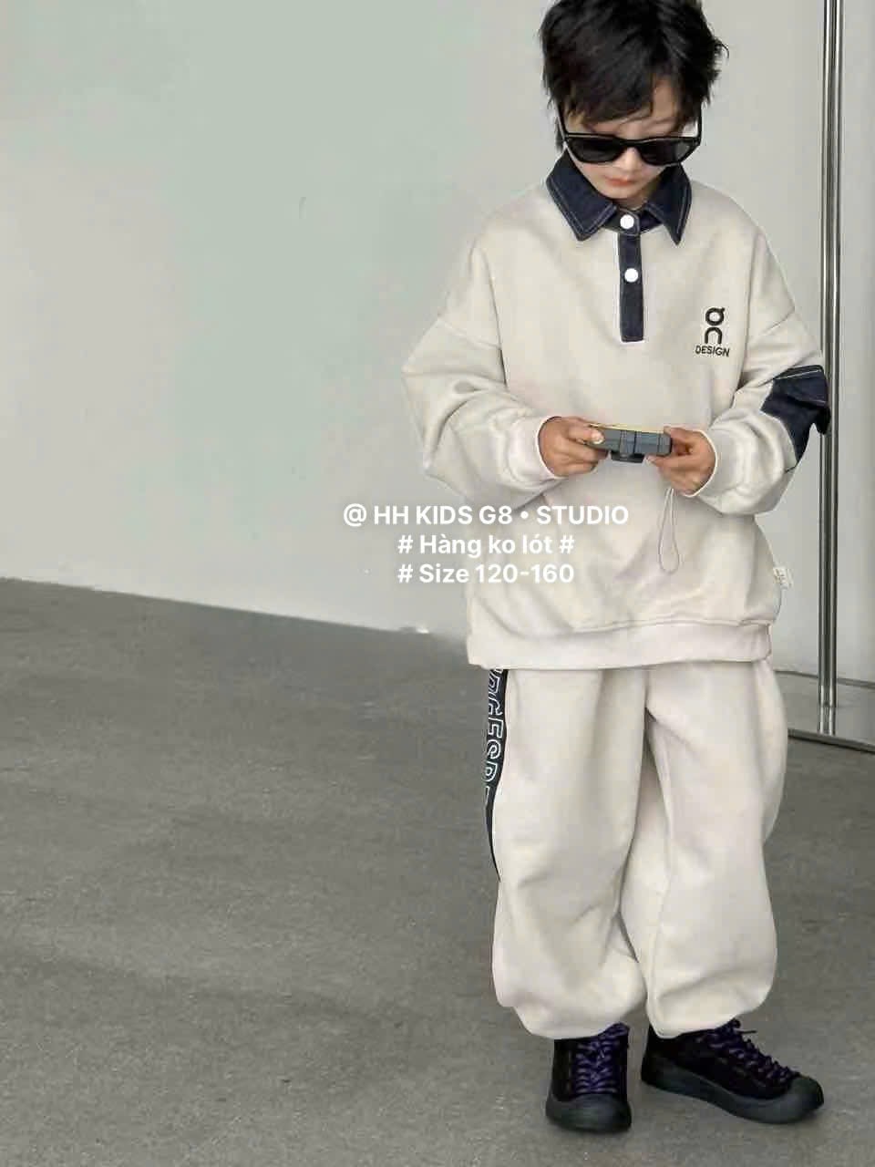 D312 - Bộ nỉ hai da cổ đức tay phối hai màu đen/be bé trai size 120-160